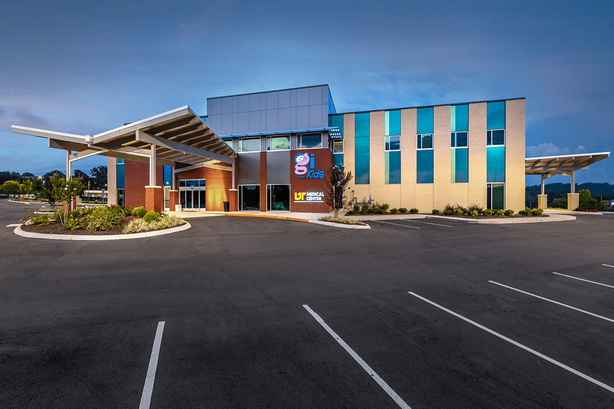Modern healthcare facility exterior featuring "GI for Kids" and "UT Medical Center" signage, designed and built by George Ewart, a top commercial architect firm in Knoxville, TN.