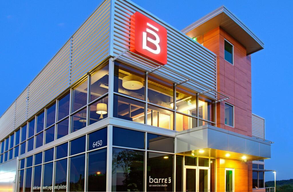 Commercial building exterior featuring barre3 exercise studio signage, designed and built by George Ewart, a top commercial architect firm in Knoxville, TN.