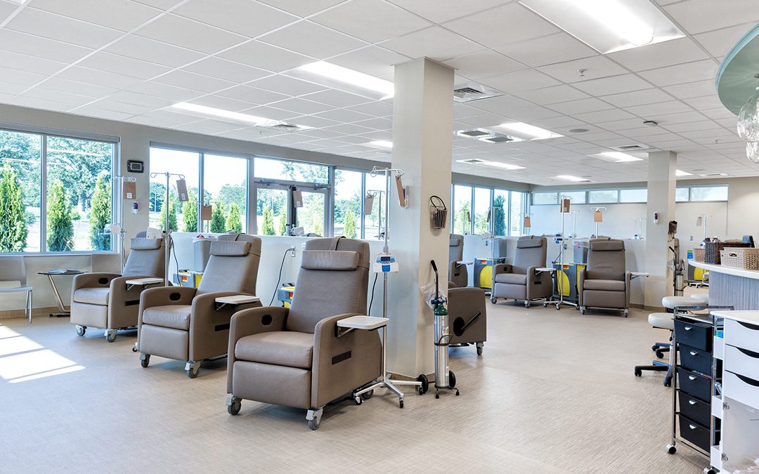 Comfortable treatment area featuring ergonomic recliners and large windows, designed and built by George Ewart, a top commercial architect firm in Knoxville, TN, emphasizing user comfort in healthcare environments.