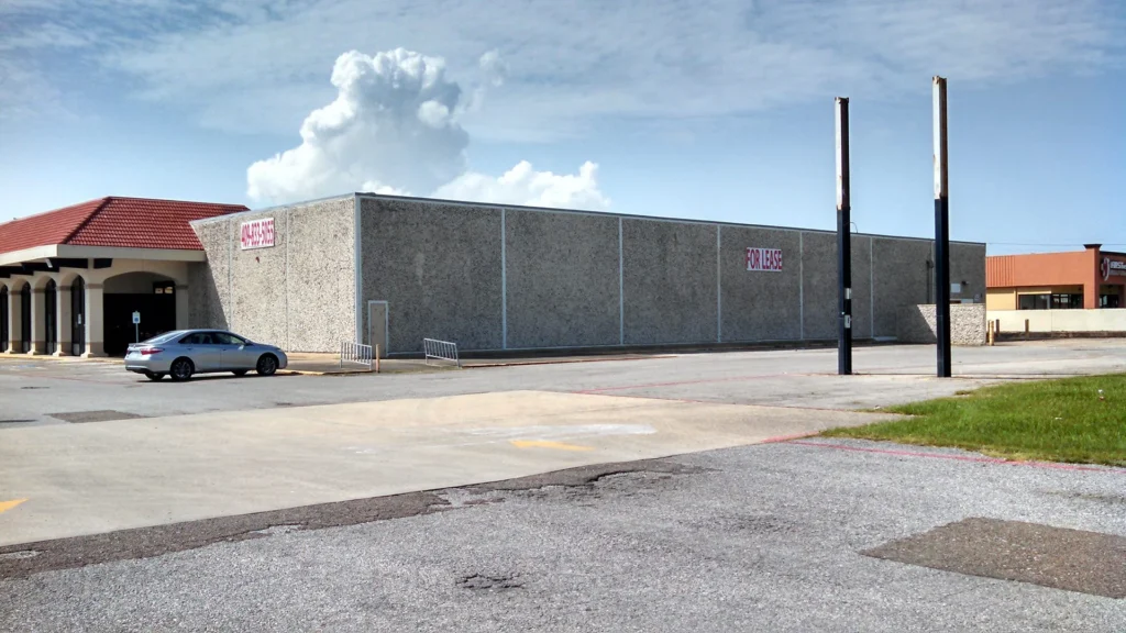 Old grocery store building for lease, potential site for specialty hospital renovation by CHRISTUS Health, designed and built by George Ewart, a top commercial architect firm in Knoxville, TN.