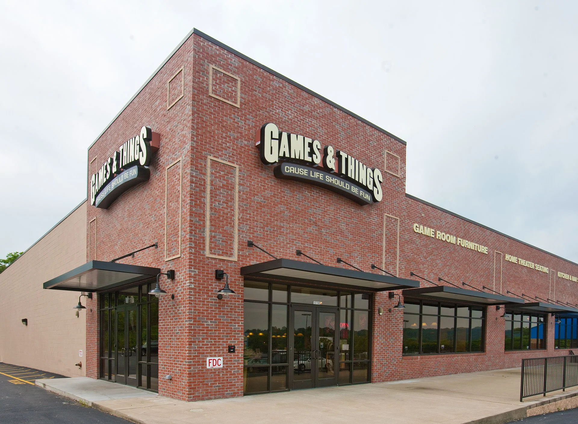 Games & Things retail exterior showcasing brick facade, large signage, and inviting entrance, designed and built by George Ewart, a top commercial architect firm in Knoxville, TN.