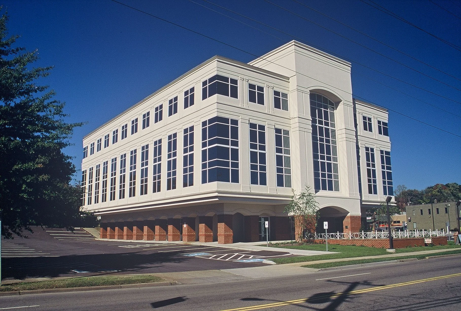 Meridian Building in Knoxville, TN, showcasing modern architectural design with large windows and renovated office space, designed and built by George Ewart, a top commercial architect firm in Knoxville, TN.