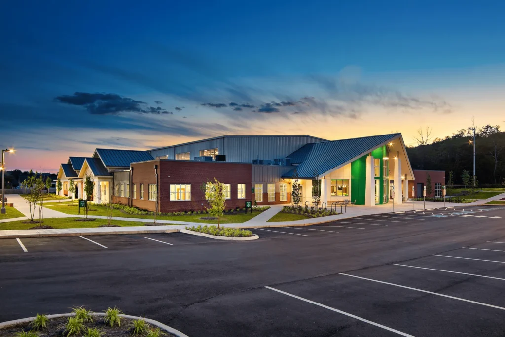 Emerald Youth Foundation community center in Knoxville, TN, featuring modern architecture, landscaped pathways, and a welcoming entrance, designed and built by George Ewart, a top commercial architect firm in Knoxville, TN.