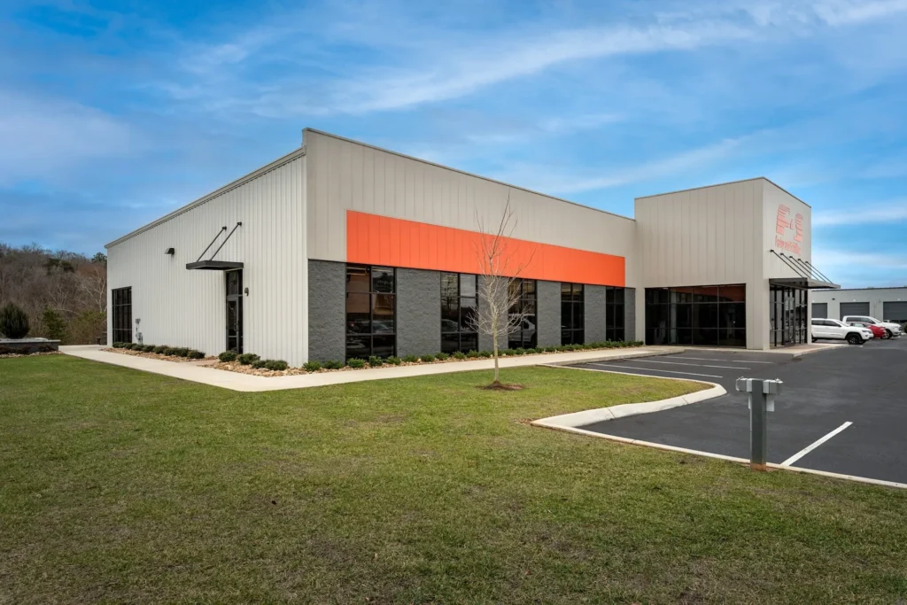 Fraley & Schilling corporate headquarters in Knoxville, TN, featuring modern architecture with an orange accent, designed and built by George Ewart, a top commercial architect firm in Knoxville, TN.