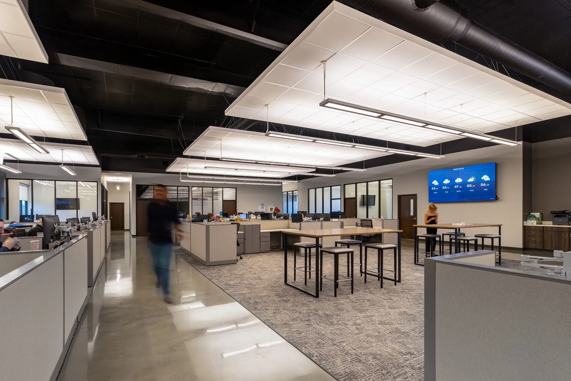 Open office layout of Fraley & Schilling headquarters in Knoxville, TN, featuring modern workstations, collaborative spaces, and integrated branding elements, designed and built by George Ewart, a top commercial architect firm in Knoxville, TN.