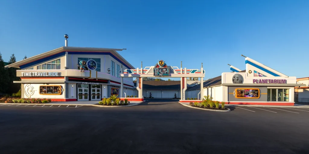 Exterior view of the Truth Traveler attraction in Pigeon Forge, featuring the Time Travel Ride entrance and Planetarium, designed and built by George Ewart, a top commercial architect firm in Knoxville, TN.