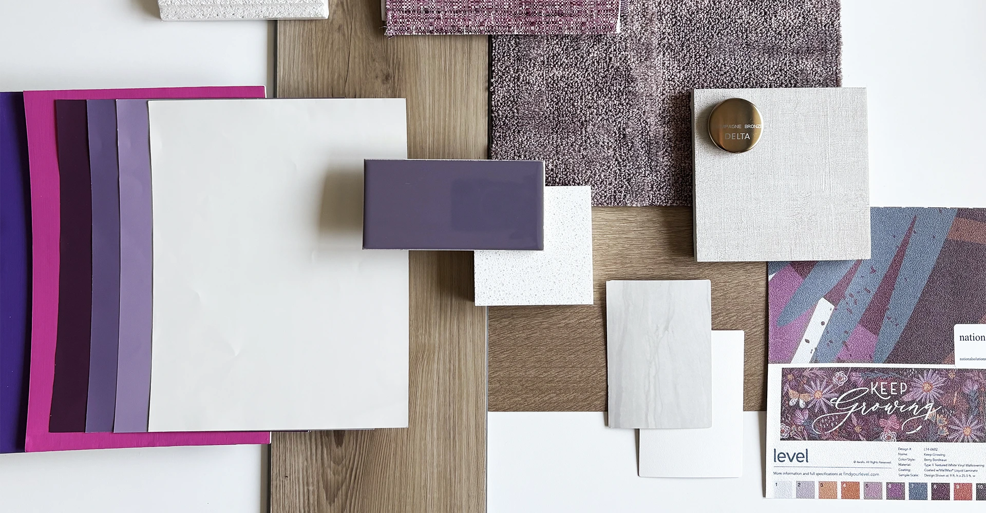 Colorful material samples including purple, white, and textured fabrics arranged on a surface, showcasing innovative design options for commercial architecture and interior design by GAE Architecture + Design, emphasizing sustainability and functionality.