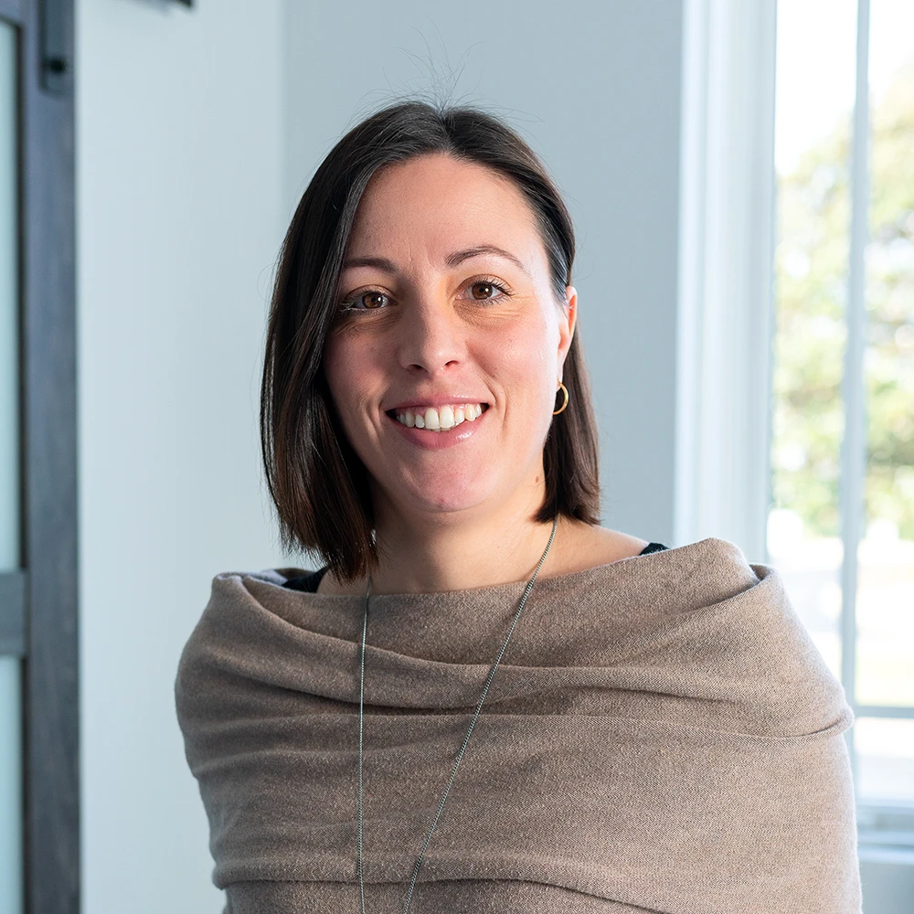 Monia Fregonese, Architectural Associate at GAE Architecture + Design, smiling in a professional setting, showcasing her commitment to sustainable architecture in Knoxville, TN.