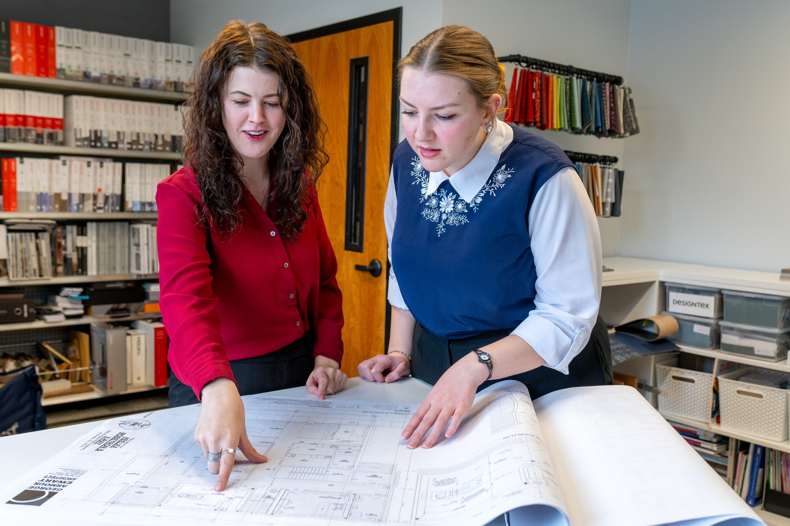 gae interior designers reviewing commercial architecture plans, gae architecture + design